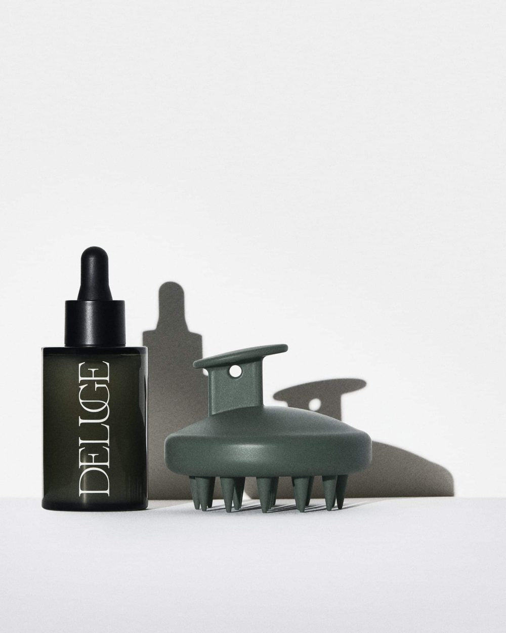 Fortifying Scalp Serum bottle with scalp massager